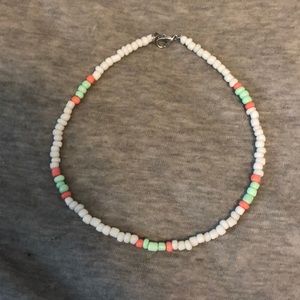 white neckalace with mint green and pink details
